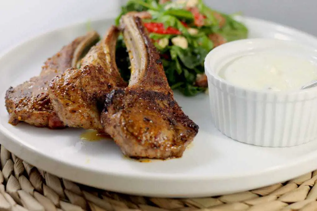 Keto Lamb Cutlets with Harissa Spice and Tzatziki by Aussie Keto Queen. Simple, tasty and keto friendly, these keto lamb cutlets use the complex flavour of Harissa Seasoning, paired with creamy and fresh tzatziki for the perfect week night meal! 