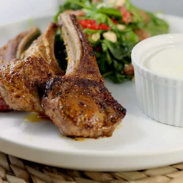 Keto Lamb Cutlets with Harissa Spice and Tzatziki by Aussie Keto Queen. Simple, tasty and keto friendly, these keto lamb cutlets use the complex flavour of Harissa Seasoning, paired with creamy and fresh tzatziki for the perfect week night meal! 