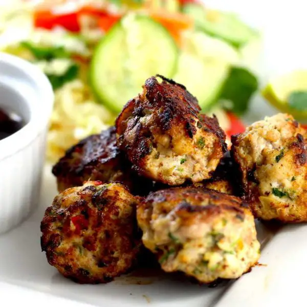 These tangy and spicy Keto Vietnamese Chicken Meatballs are perfect with the crispy fresh salad, and powerful Vietnamese style salad dressing by Rachel Burke Aussie Keto Queen. Keto vietnamese chicken, keto chicken balls, keto chicken meatballs, keto vietnamese meatballs, keto vietnamese salad.