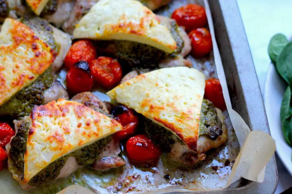 Keto Pesto Chicken Bake with Haloumi recipe by Aussie Keto Queen. Succulent chicken thighs, topped with basil pesto and haloumi and grilled to perfect. A quick family favourite that is no fuss! Serves two small chicken thighs per person.