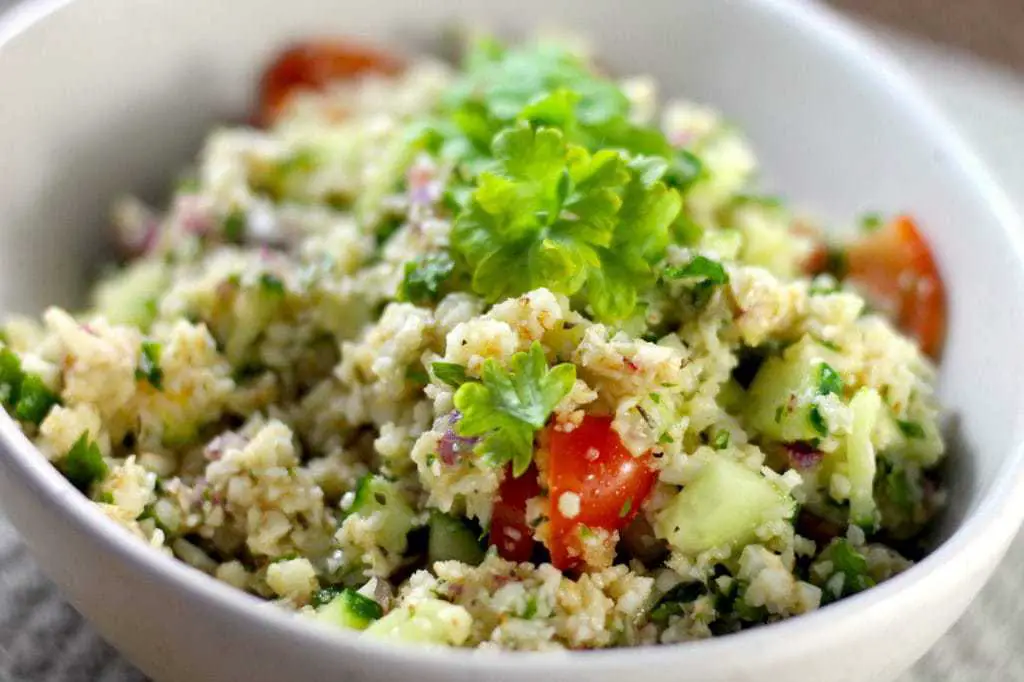 Keto TaboulehKeto Tabouleh Salad with Cauliflower by Aussie Keto Queen. This fresh and vibrant salad uses plenty of fresh herbs and cauliflower to create a tasty and quick side #keto #ketorecipes #ketogenicdiet