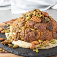 Vegetarian Keto Whole Roasted Cauliflower by Aussie Keto Queen is bursting with Middle Eastern spices and so much flavour, plus a crunchy nutmix on top and a tasty tahini dressing. The ultimate vegetarian Keto main, or a fantastic side dish! #keto #ketorecipes #ketogenicdiet