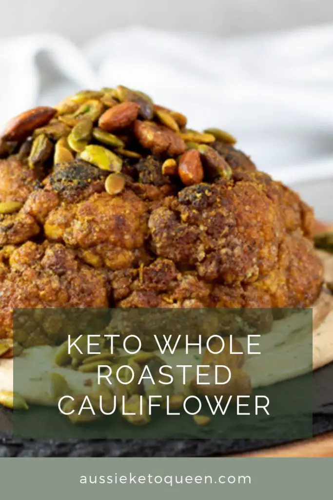 Vegetarian Keto Whole Roasted Cauliflower is bursting with Middle Eastern spices and so much flavour, plus a crunchy nutmix on top and a tasty tahini dressing. The ultimate vegetarian Keto main, or a fantastic side dish! #keto #ketorecipes #ketogenicdiet